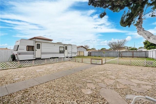 211 S K St, Lompoc, CA 93436 - rear view of house featuring a fenced backyard