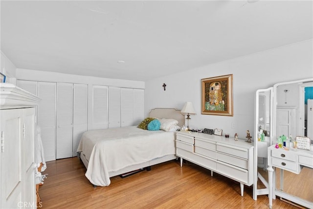 211 S K St, Lompoc, CA 93436 - bedroom with light wood-type flooring and multiple closets
