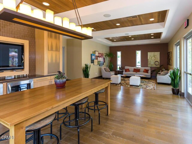13124 Central Ave Unit 201, Hawthorne, CA 90250 - dining area with wood finished floors, a raised ceiling, and wood ceiling