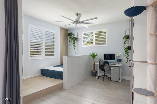 13124 Central Ave Unit 201, Hawthorne, CA 90250 - bedroom featuring wood finished floors, a desk, ceiling fan, and baseboards