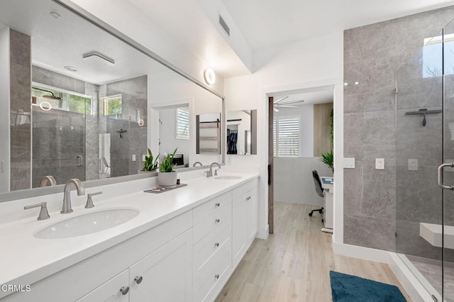 13124 Central Ave Unit 201, Hawthorne, CA 90250 - full bath with wood finished floors, plenty of natural light, double vanity, and a stall shower