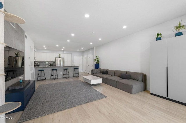 13124 Central Ave Unit 201, Hawthorne, CA 90250 - living area with recessed lighting and light wood-style flooring