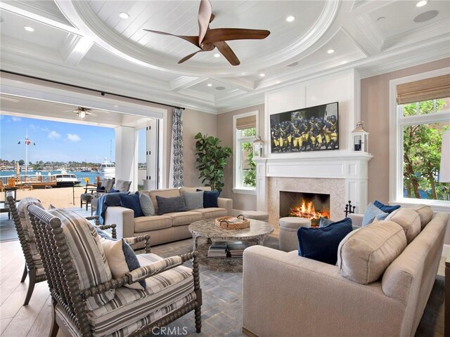 1324 E Balboa Blvd, Newport Beach, CA 92661 - living area featuring coffered ceiling, ceiling fan, ornamental molding, a lit fireplace, and recessed lighting