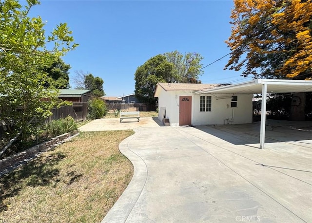 1507 4th St, Norco, CA 92860 - view of home's exterior featuring an attached carport, concrete driveway, and stucco siding