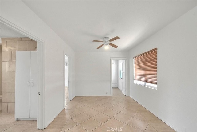 1507 4th St, Norco, CA 92860 - empty room with ceiling fan, light tile patterned floors, and baseboards