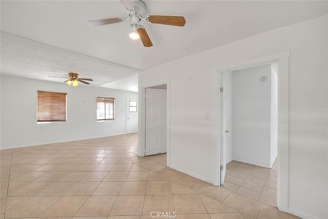 1507 4th St, Norco, CA 92860 - empty room with a ceiling fan, light tile patterned floors, and baseboards
