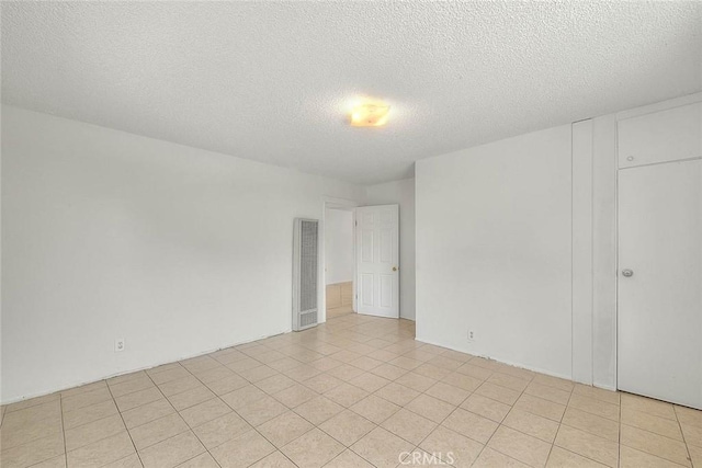 1507 4th St, Norco, CA 92860 - empty room with a heating unit and a textured ceiling