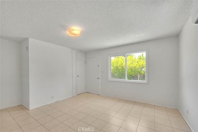 1507 4th St, Norco, CA 92860 - unfurnished room featuring a textured ceiling and light tile patterned flooring