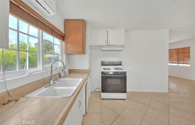 1507 4th St, Norco, CA 92860 - kitchen featuring white range with gas cooktop, a sink, healthy amount of natural light, and range hood