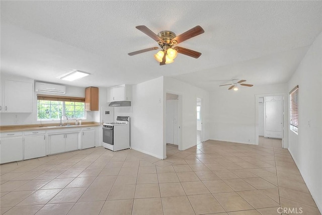 1507 4th St, Norco, CA 92860 - kitchen featuring white gas range oven, a sink, ceiling fan, light countertops, and light tile patterned floors