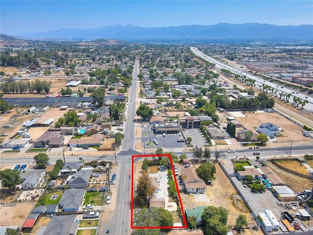 1507 4th St, Norco, CA 92860 - aerial perspective of suburban area with mountains and property parcel outlined