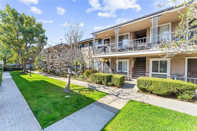 660 S Glassell St Unit 14, Orange, CA 92866 - surrounding community with stairway and a yard
