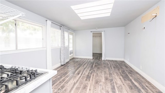 1541 N Stanley Ave, Los Angeles, CA 90046 - kitchen featuring wood finished floors, baseboards, and stainless steel gas cooktop