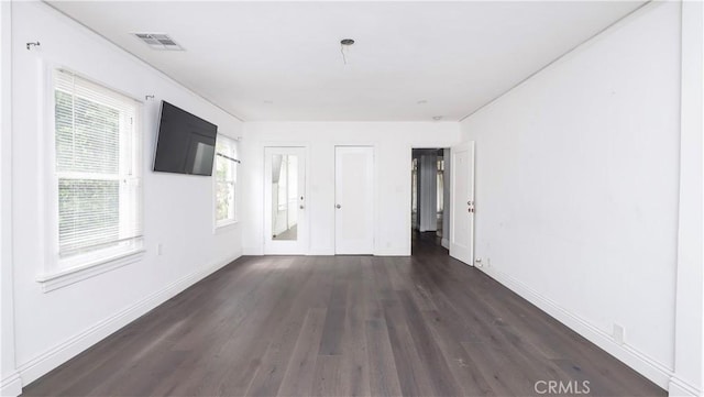 1541 N Stanley Ave, Los Angeles, CA 90046 - unfurnished room with dark wood finished floors, plenty of natural light, and baseboards