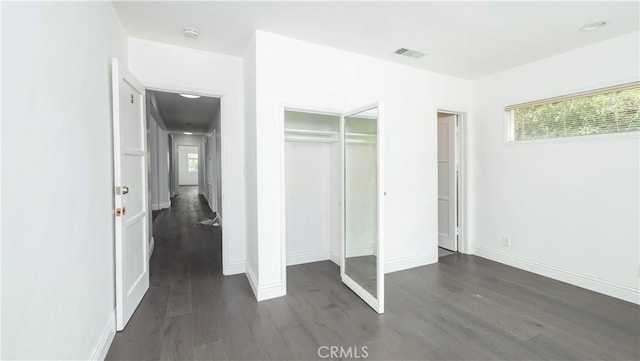 1541 N Stanley Ave, Los Angeles, CA 90046 - unfurnished bedroom featuring wood finished floors, baseboards, and a closet
