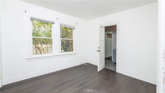 1541 N Stanley Ave, Los Angeles, CA 90046 - unfurnished room with dark wood-style floors and baseboards