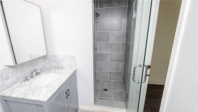 1541 N Stanley Ave, Los Angeles, CA 90046 - full bath featuring a shower stall, vanity, backsplash, and wood finished floors