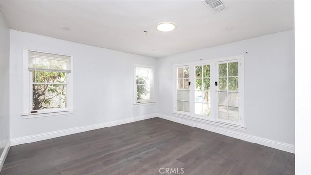 1541 N Stanley Ave, Los Angeles, CA 90046 - spare room featuring baseboards, dark wood-style flooring, and plenty of natural light