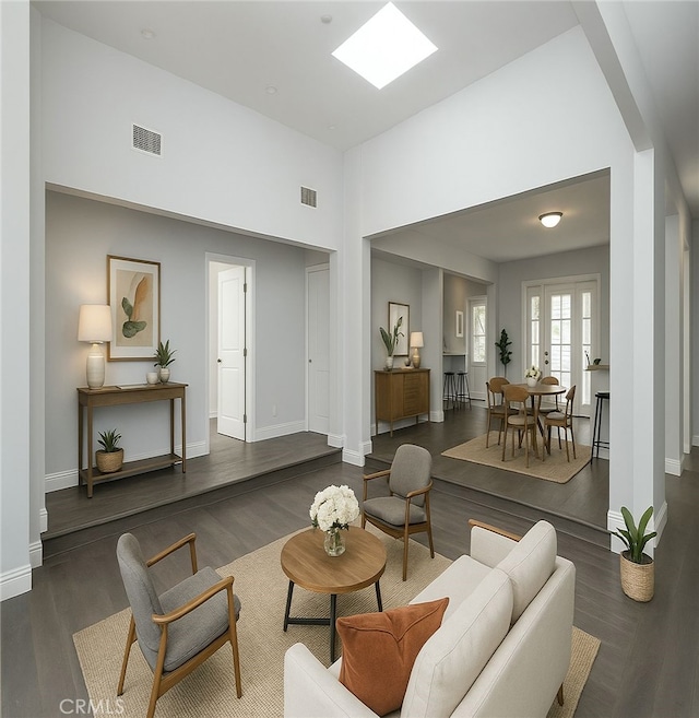 1541 N Stanley Ave, Los Angeles, CA 90046 - living room featuring wood finished floors, baseboards, and a towering ceiling