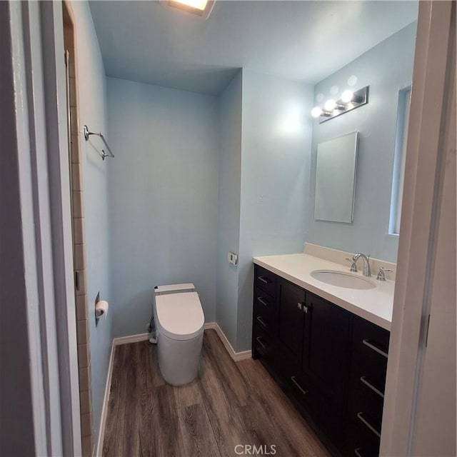 3473 Mclean St, Eureka, CA 95501 - bathroom featuring wood finished floors, vanity, toilet, and baseboards