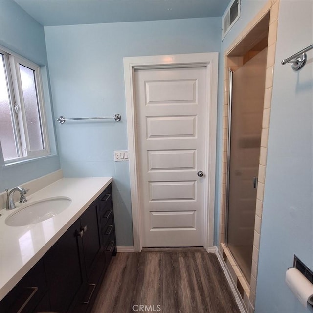 3473 Mclean St, Eureka, CA 95501 - full bath with wood finished floors, a stall shower, and vanity
