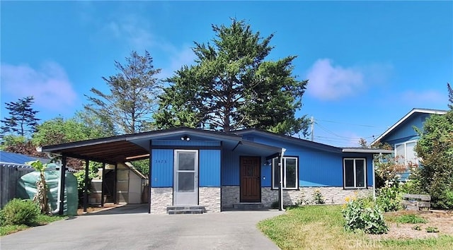 3473 Mclean St, Eureka, CA 95501 - view of front of property featuring stone siding, asphalt driveway, and an attached carport