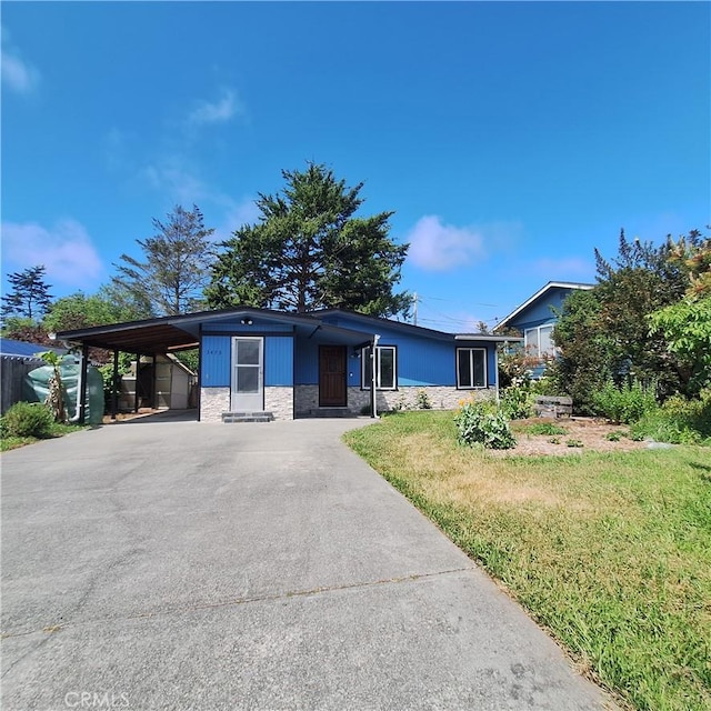 3473 Mclean St, Eureka, CA 95501 - view of front of property with concrete driveway, an attached carport, and a front yard