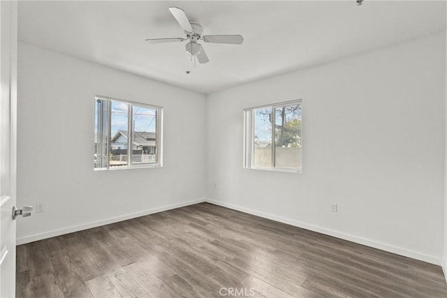 821 W 43rd Pl, Los Angeles, CA 90037 - empty room featuring plenty of natural light, wood finished floors, baseboards, and a ceiling fan