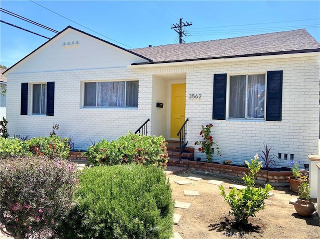 3562 N Studebaker, Long Beach, CA 90808 - view of front of property with brick siding, roof with shingles, and entry steps