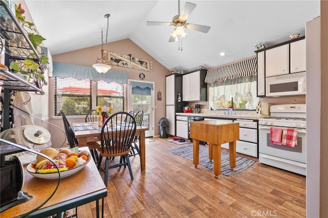 73 Mockingbird Ln, Templeton, CA 93465 - kitchen with white appliances, vaulted ceiling, plenty of natural light, ceiling fan, and light wood-style flooring