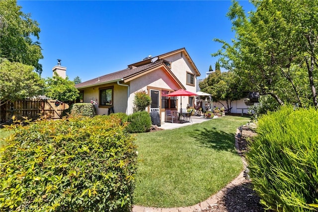 73 Mockingbird Ln, Templeton, CA 93465 - back of house with stucco siding, a patio, and a chimney