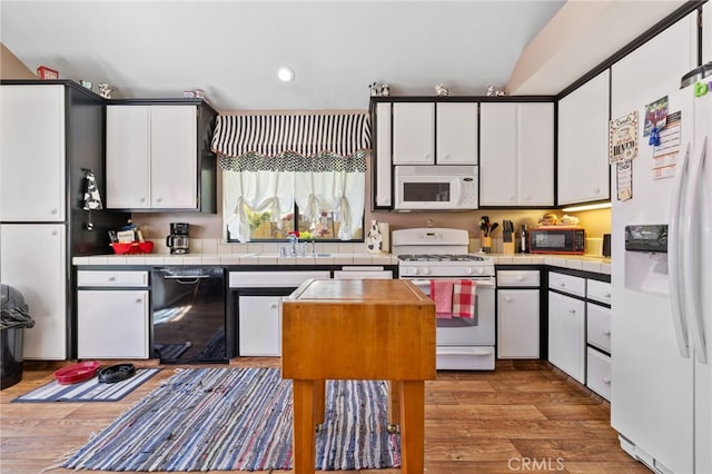 73 Mockingbird Ln, Templeton, CA 93465 - kitchen featuring black appliances, tile countertops, a sink, white cabinets, and recessed lighting