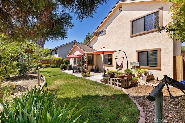 73 Mockingbird Ln, Templeton, CA 93465 - rear view of property with stucco siding and a patio