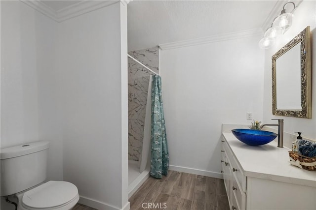12235 Circula Panorama, North Tustin, CA 92705 - bathroom featuring vanity, toilet, wood finished floors, a stall shower, and crown molding