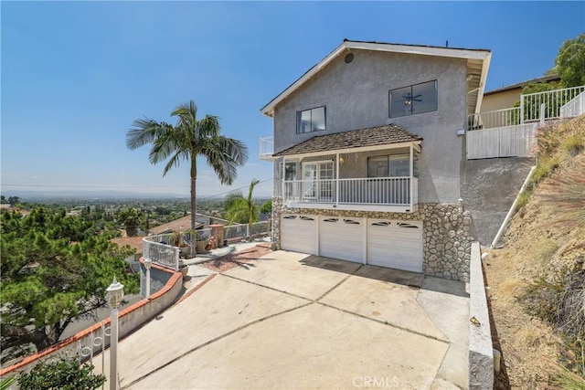 12235 Circula Panorama, North Tustin, CA 92705 - view of front of home featuring stucco siding, an attached garage, and driveway