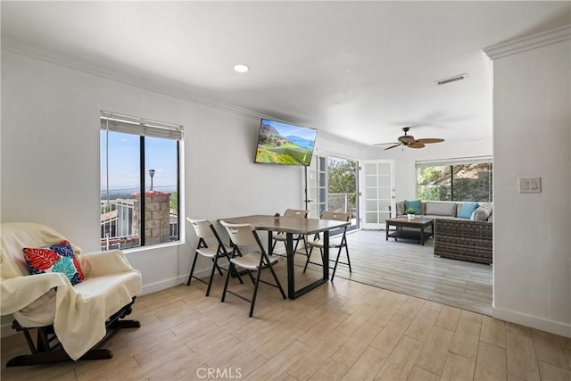 12235 Circula Panorama, North Tustin, CA 92705 - dining room with baseboards, light wood-style flooring, crown molding, and ceiling fan