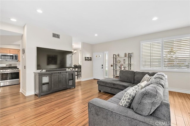 18102 Flynn Dr Unit 4602, Canyon Country, CA 91387 - living room with light wood-style floors, baseboards, recessed lighting, and a chandelier