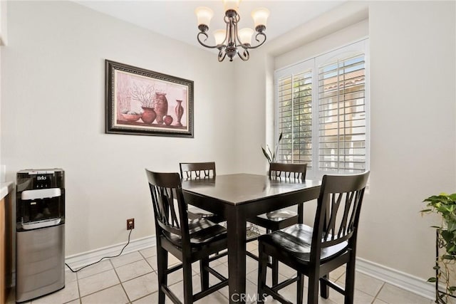 18102 Flynn Dr Unit 4602, Canyon Country, CA 91387 - dining area featuring light tile patterned flooring, a chandelier, and baseboards