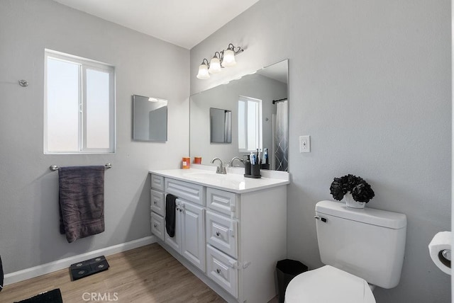 158 W Del Amo Blvd, Long Beach, CA 90805 - bathroom with vanity, plenty of natural light, and wood finished floors