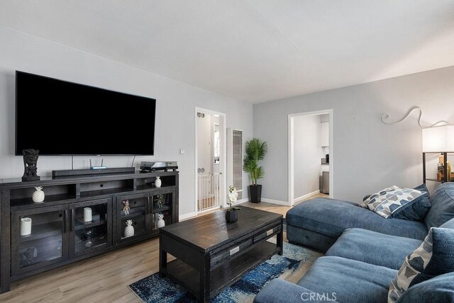 158 W Del Amo Blvd, Long Beach, CA 90805 - living room with light wood finished floors and baseboards