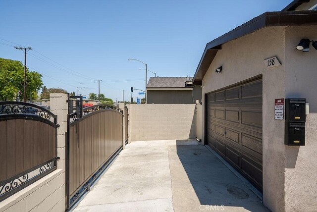 158 W Del Amo Blvd, Long Beach, CA 90805 - garage featuring a gate and driveway