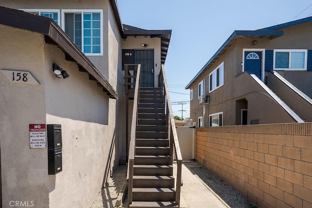 158 W Del Amo Blvd, Long Beach, CA 90805 - view of side of property with stucco siding and stairway
