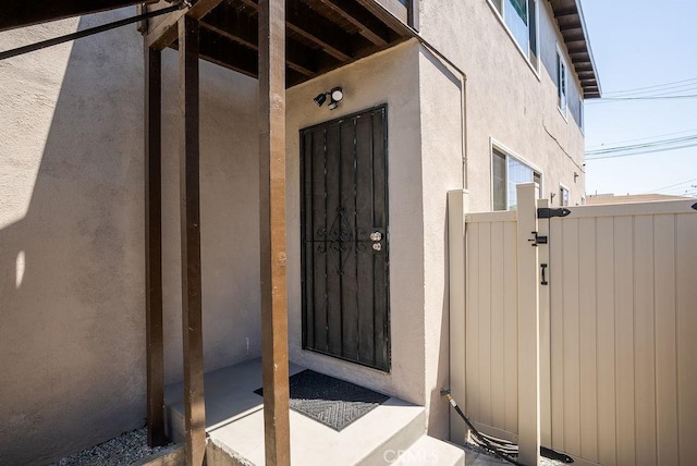 158 W Del Amo Blvd, Long Beach, CA 90805 - view of exterior entry with a gate and stucco siding