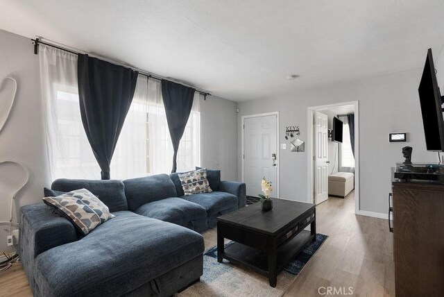 158 W Del Amo Blvd, Long Beach, CA 90805 - living area with healthy amount of natural light and light wood-style flooring