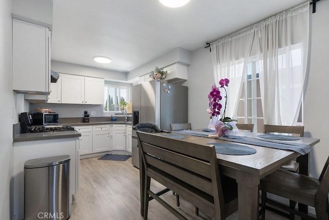 158 W Del Amo Blvd, Long Beach, CA 90805 - dining space with light wood finished floors
