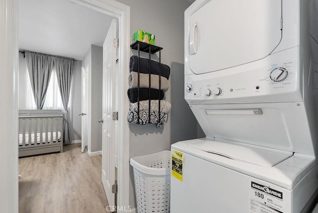 158 W Del Amo Blvd, Long Beach, CA 90805 - laundry area featuring stacked washing machine and dryer and light wood-style floors