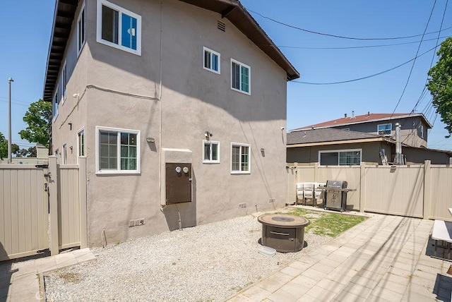 158 W Del Amo Blvd, Long Beach, CA 90805 - back of house featuring stucco siding, a patio, a gate, and a fire pit