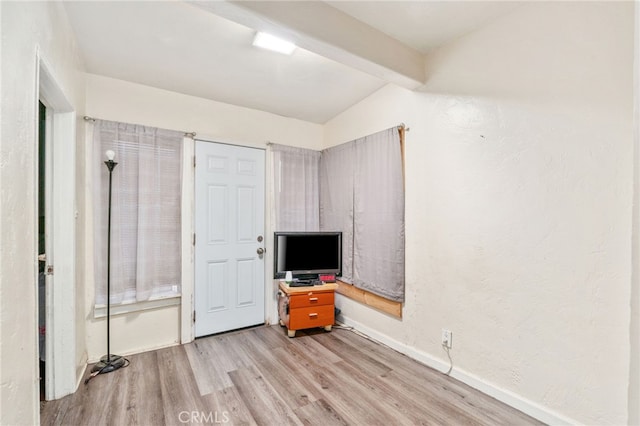 1415 W 104th St, Los Angeles, CA 90047 - unfurnished bedroom with light wood-type flooring, beam ceiling, and baseboards