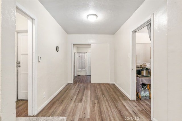 1415 W 104th St, Los Angeles, CA 90047 - hall featuring wood finished floors and baseboards