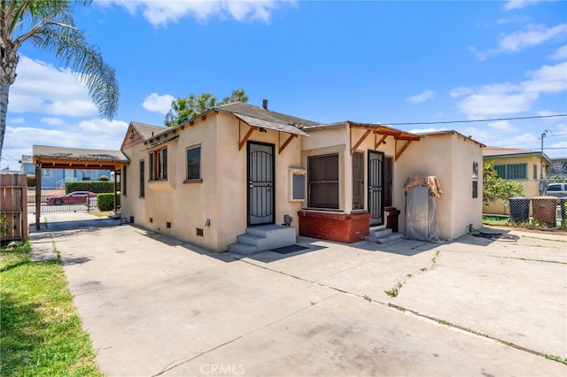 1415 W 104th St, Los Angeles, CA 90047 - view of front of home with stucco siding, crawl space, a gate, and entry steps